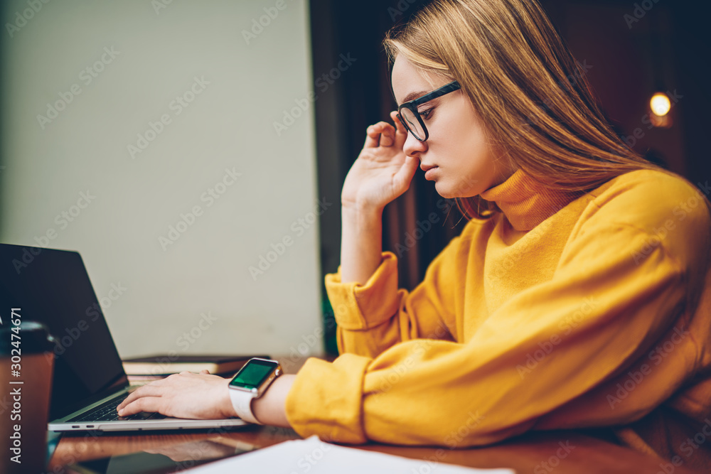 Poster hipster girl making payment online for multimedia files from internet website or web store using goo