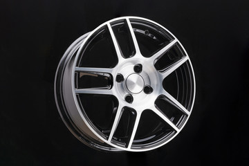 Alloy rim on black background, alloy wheels closeup. The elements spokes