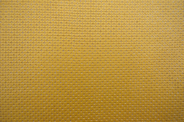 Upholstery material. Background, texture of yellow with glitter.