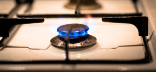Obraz premium Blurred gas hob and blue flame
