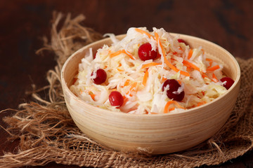 Homemade Traditional sauerkraut with carrots and cranberries