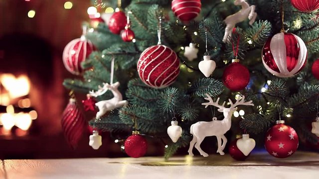 Christmas Tree with Red Balls and Deers. Winter Holiday Background