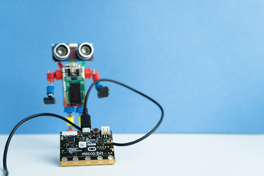 Minsk, Belarus. October, 2019. The BBC robot Micro Bit is near the robot. It can be programming on Scratch and Python. Creative. Connected. Coding. Learning, teaching easy and fun. Free space for text