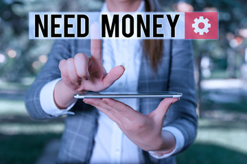 Text sign showing Need Money. Business photo text require a financial assistance to sustain spending or endeavor Outdoor scene with business woman holds lap top with touch screen