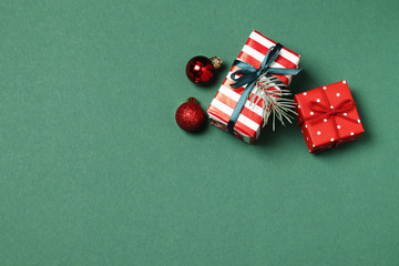 Composition of christmas gift boxes on green background. Top view. Place for text.