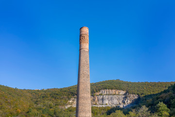 Tall old factory chimney, an aerial view