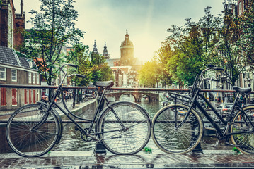 Rainy day in Amsterdam. Rainy cloudy day in the capital of the Netherlands, in the autumn. - obrazy, fototapety, plakaty