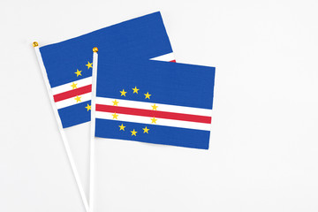 Cape Verde and Cape Verde stick flags on white background. High quality fabric, miniature national flag. Peaceful global concept.White floor for copy space.