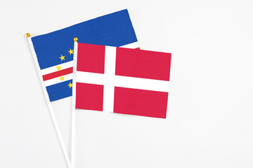 Denmark and Cape Verde stick flags on white background. High quality fabric, miniature national flag. Peaceful global concept.White floor for copy space.