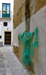 fishing nets in the alleys of the historic center of Mazara del Vallo Sicily Italy