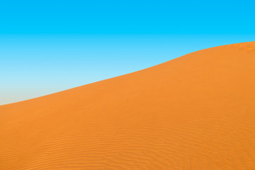 Big Desert Sand Dune with Blue Sky Background