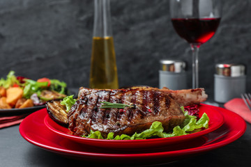 Delicious beef steak served on grey table, closeup