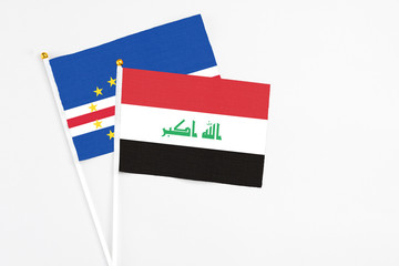Iraq and Cape Verde stick flags on white background. High quality fabric, miniature national flag. Peaceful global concept.White floor for copy space.