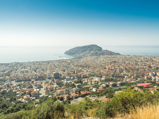 Obraz premium Alanya, Turkey. Beautiful panoramic top view of the city of Alanya and the Mediterranean Sea from the mountain. Vacation postcard background