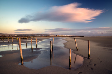 The Jara River flowing into Los Lances Beach at sunset in the Strait Natural Park, Tarifa, Cadiz province, Andalusia, Spain. © inigolaitxu