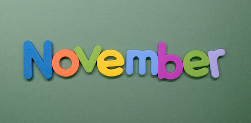 Word November written with color sponge