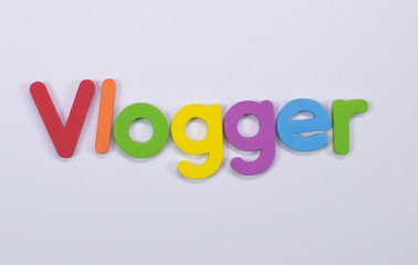 Word Vlogger written with color sponge