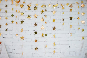Background white brick wall with shining stars.
