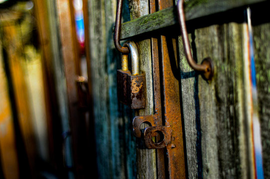 Padlock On Old Wooden Door