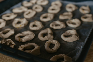 raw donuts or donuts on the baking sheet