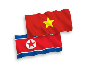 Flags of North Korea and Vietnam on a white background