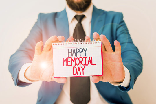 Word writing text Happy Memorial Day. Business photo showcasing Honoring Remembering those who died in military service Man holds empty paper with copy space in front of him Copy Space
