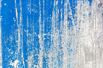 Fototapeta premium Blue and white texture grunge background. Surface covered with peeling paint, stains, scratches, stripes