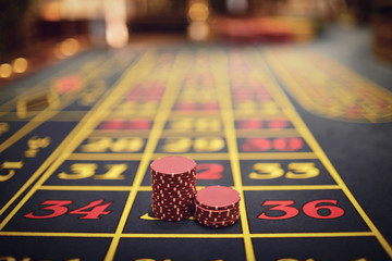 Roulette chips on a gaming table in a casino.