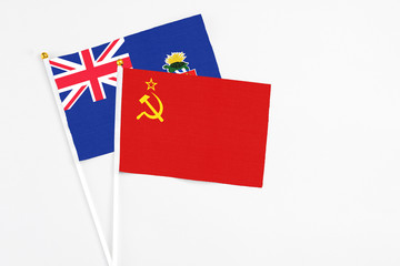 Soviet Union and Cayman Islands stick flags on white background. High quality fabric, miniature national flag. Peaceful global concept.White floor for copy space.