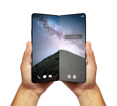 Woman hand holding Smartphone blank screen with fold feature - modern construction, future of modern smartphones or tablets, wallpaper with galaxy, milky way in mountains 