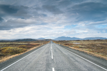 Tarmac scenic road at Iceland. Beautiful landscape, cloudy blue sky. Backplate.