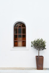 Arched Stained Glass Window on White Wall