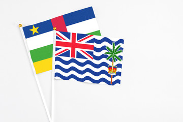 Fototapeta premium British Indian Ocean Territory and Central African Republic stick flags on white background. High quality fabric, miniature national flag. Peaceful global concept.White floor for copy space.