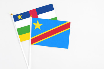 Congo and Central African Republic stick flags on white background. High quality fabric, miniature national flag. Peaceful global concept.White floor for copy space.