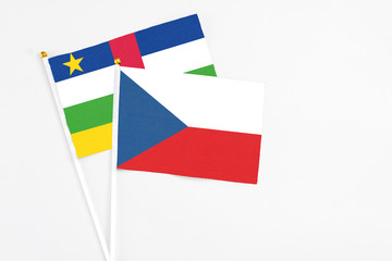 Czech Republic and Central African Republic stick flags on white background. High quality fabric, miniature national flag. Peaceful global concept.White floor for copy space.