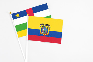 Ecuador and Central African Republic stick flags on white background. High quality fabric, miniature national flag. Peaceful global concept.White floor for copy space.