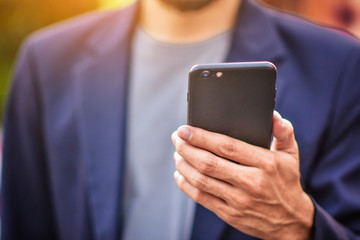 Businessman holding cell phone using Mobile phone or Smart phone Telephone to call phone with...