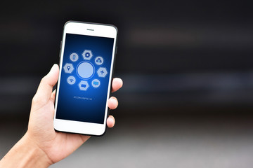 Businessman holding cell phone using Mobile phone or Smart phone Telephone to call phone with Social media Icon technology by WiFi internet  Network digital