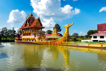 A huge Thai Suphannahong, also called Golden Swan or Phoenix boat at the WatpahSuphannahong Temple sunlight day  time in sisaket, Thailand