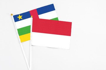 Indonesia and Central African Republic stick flags on white background. High quality fabric, miniature national flag. Peaceful global concept.White floor for copy space.