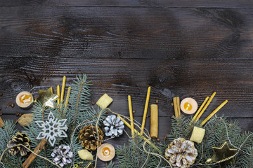 Christmas background. Christmas toys-balls, snowflakes, cones on the Christmas tree, wooden background. The view from the top. Copy space for text