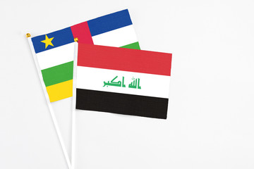 Iraq and Central African Republic stick flags on white background. High quality fabric, miniature national flag. Peaceful global concept.White floor for copy space.