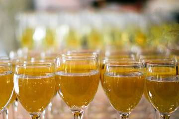 Celebratory buffet table. Drinks in glass glasses.