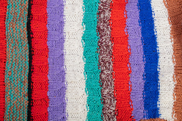 Obraz premium Knitted multi-colored texture. Background knitted product close-up.