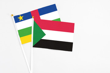 Sudan and Central African Republic stick flags on white background. High quality fabric, miniature...