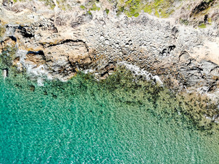 Aerial view of rocks and sea at Agnes Water Main Beach