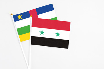 Syria and Central African Republic stick flags on white background. High quality fabric, miniature...