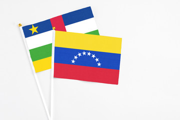 Venezuela and Central African Republic stick flags on white background. High quality fabric, miniature national flag. Peaceful global concept.White floor for copy space.