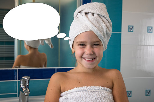Funny picture with bubble idea little girl in bathroom with towel on a head.