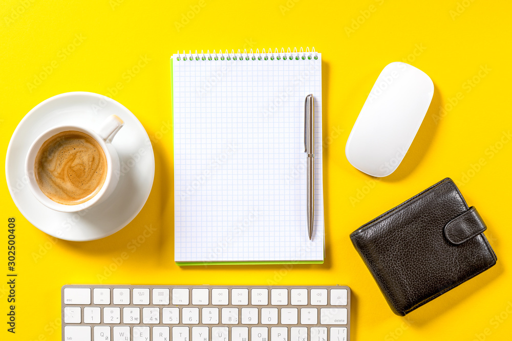 Poster top view of business working place with cup of coffee, empty workspace on yellow table background.